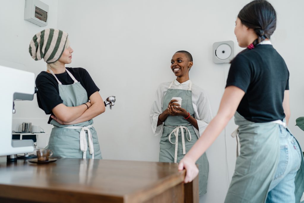 Women at work in a kitchen, enjoying each other's company.
