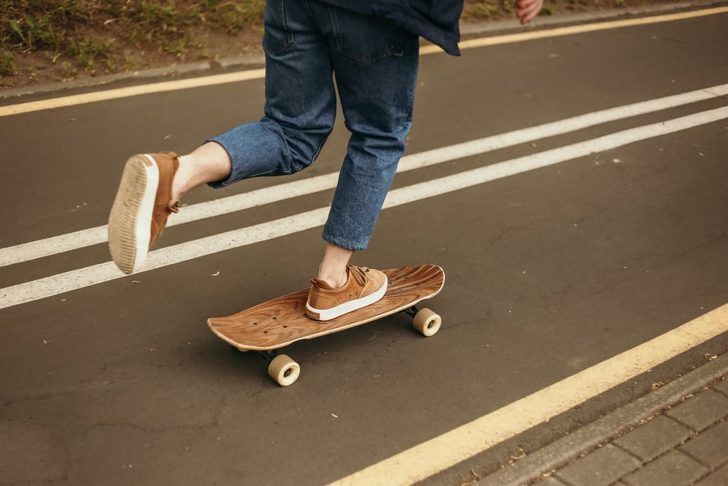 photo of a pair of legs on a skateboard - goal setting for entrepreneurs includes doing fun things for yourself