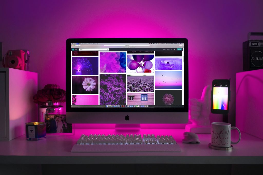 picture of a laptop with engaging content on it to put on your linkedin, pink hue